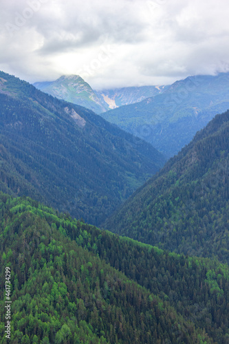 Coniferous mountains of Svaneti under the clouds. Mestia, Heshkili.