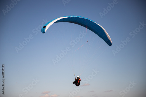 glider paragliding g against blue sky flying adrenaline and freedom concept