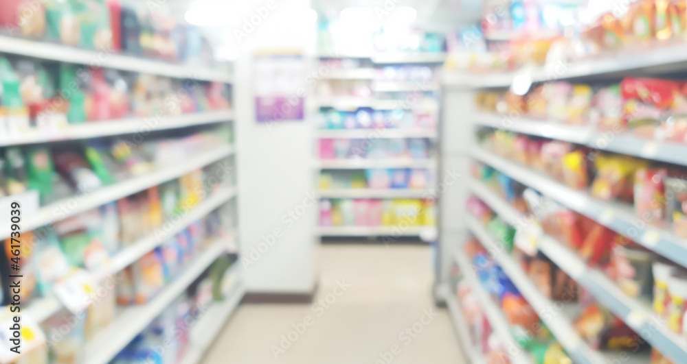 instant foor or dry food products displayed on shelf in convenient store, blurred view. interior of supermarket or grocery store. hoard instant food for quick lifestyle. consumerism concept.