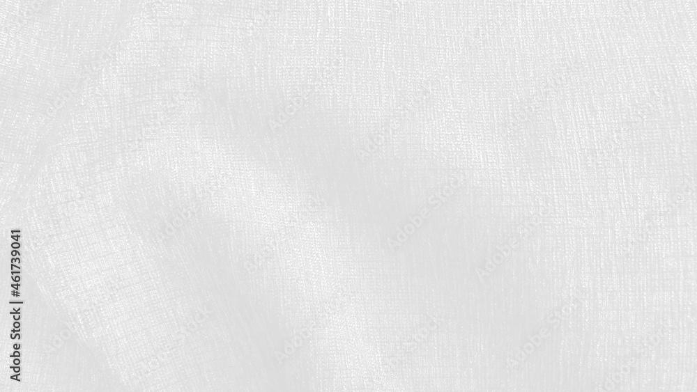 close up luxury elegance wavy and fold silk fabric texture in bright white color tone. abstract background of fabric with blank space for design. creased canvas fabric texture.