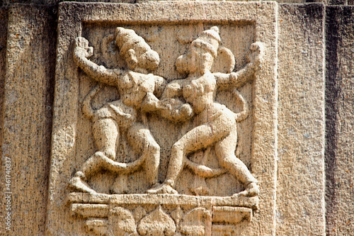 Relief sculpture of Vaali and Sugriva on stone pillar greeting each other at Rayara Gopura, India photo