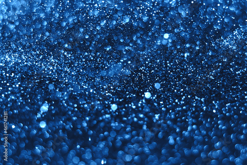 Blue sparkling glitter bokeh background, christmas abstract defocused texture. Holiday lights