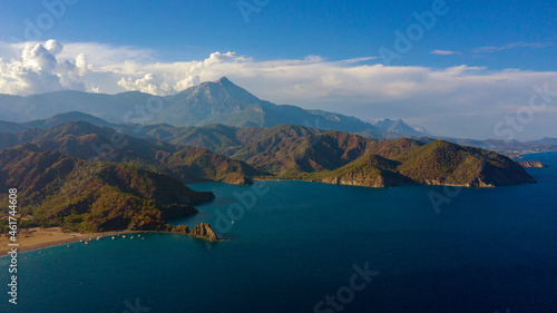 long beach coast, dark teal sea and bay in Adrasan village Mediterranean coast, great place for holiday. Aerial view with drone. Antalya