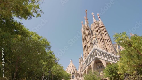 Sagrada Familia in Barcelona, Spain. Basilica, roman catholic, catalonia, summer, beautiful, blue sky, Antoni Gaudi, unesco, tourist destination / 4K Video Footage