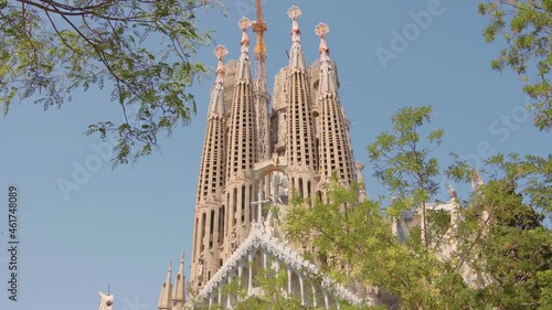 Sagrada Familia in Barcelona, Spain. Basilica, roman catholic, catalonia, summer, beautiful, blue sky, Antoni Gaudi, unesco, tourist destination / 4K Video Footage