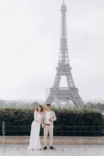 Married couple near the Eiffel tower on their wedding day. Bride and groom in Paris, France. © ALEXSTUDIO