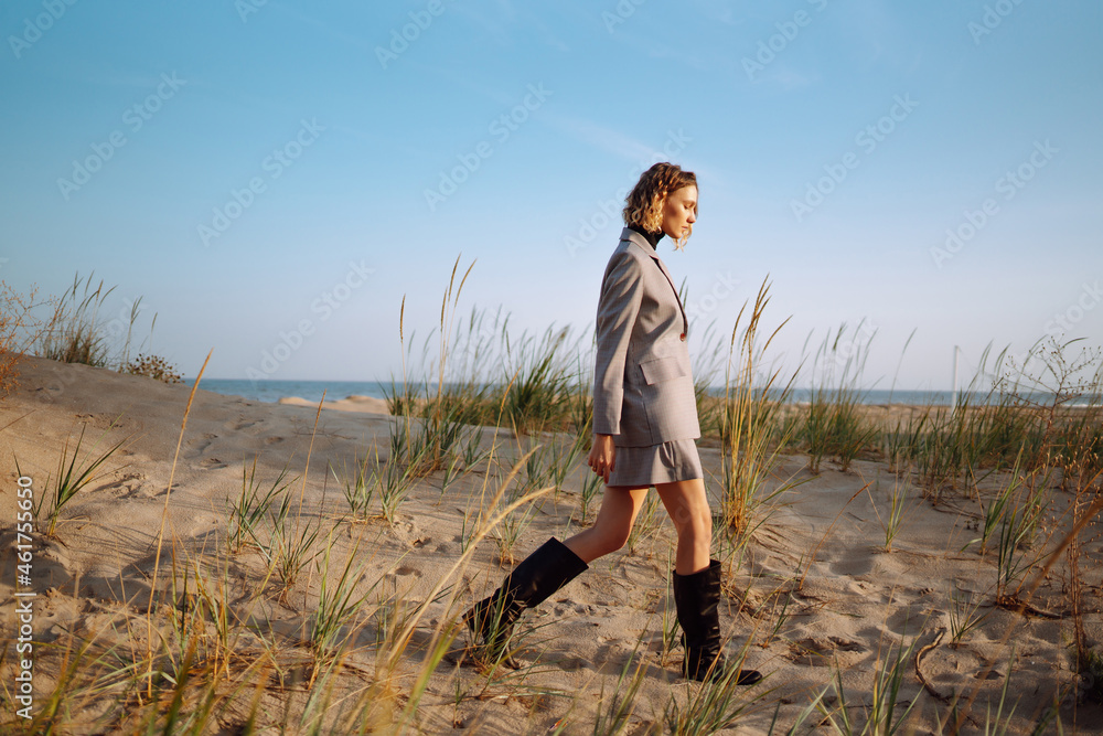 Portrait of fashion woman posing in nature. People, lifestyle, relaxation and vacations concept. Portrait of fashion woman posing in nature. People, lifestyle, relaxation and vacations concept.