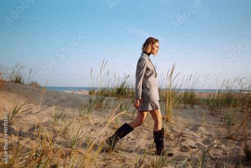 Portrait of fashion woman posing in nature. People, lifestyle, relaxation and vacations concept.