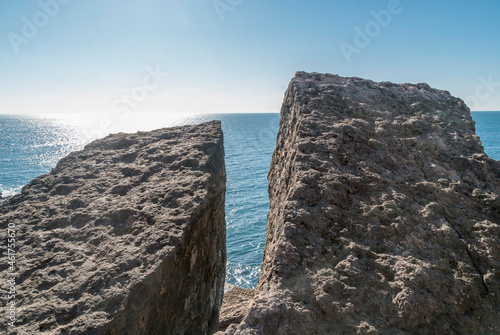 two giant rocks looking at the horizon