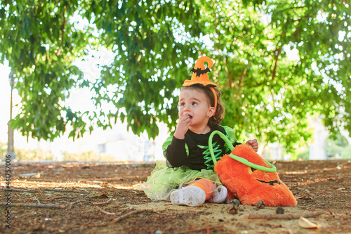 Baby in halloween costume outdoors