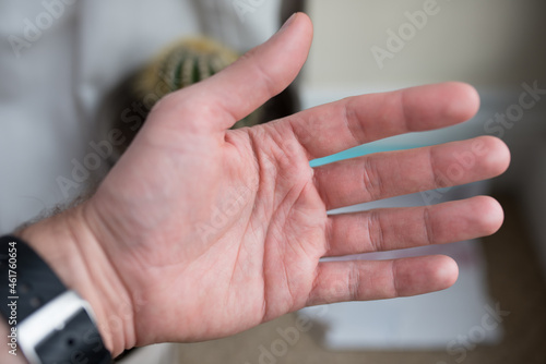 Men hand with veins visible. 