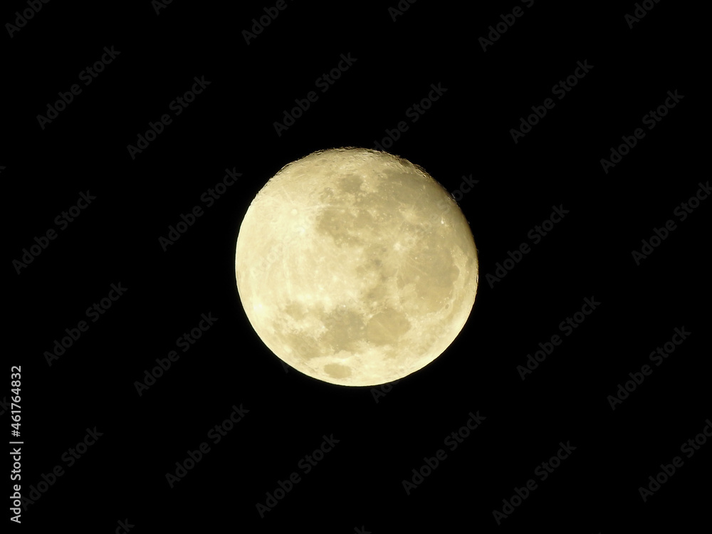 Fototapeta premium Close up view of the full moon in the clear black sky of the night.