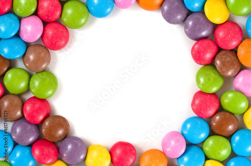 Frame of colored background of assorted candies balls