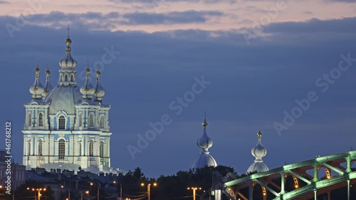 Time lapse video with Smolny cathedral and Bolsheokhtinsky bridge view. Night car traffic in Saint-Petersburg, Russia photo