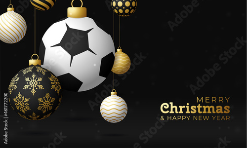 soccer Sport Christmas card. Merry Christmas sport greeting card. Hang on a thread soccer, football ball as a xmas ball and golden bauble on black horizontal background. Sport Vector illustration.