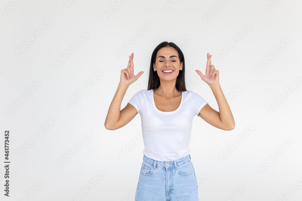 Portrait of young woman pointing hands finger at corner with copyspace on a white background Portrait of young woman pointing hands finger at corner with copyspace on a white background