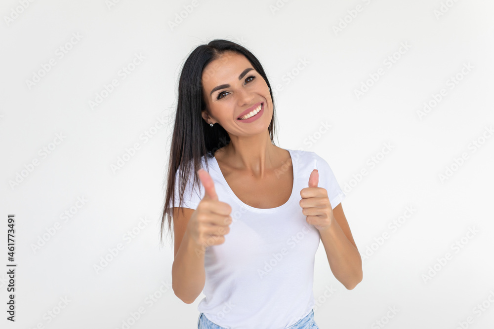 Beautiful woman showing thumbs up, isolated over a white background Beautiful woman showing thumbs up, isolated over a white background