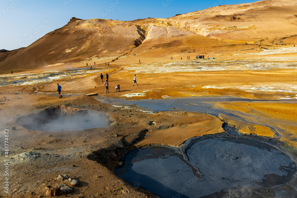 surreal landscape in   geothermal area near Lake Myvatn, Iceland.  Hverir is characterized by boiling mud pots and fumaroles that steam. 