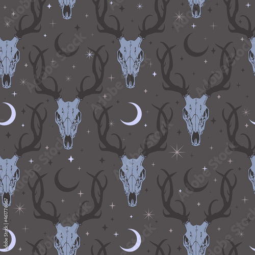 seamless illustration of deer skulls among moons and stars