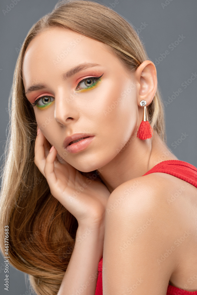 Portrait of attractivePortrait of attractive girl with healthy clean skin and beautiful make-up. Aesthetic cosmetology and makeup concept.
