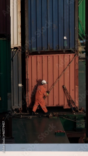 A seaman making lashing on a container ship photo