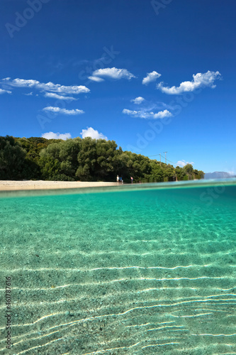 Fototapeta Naklejka Na Ścianę i Meble -  Underwater split photo of famous bay and sandy turquoise beach of Fanari with crystal clear calm sea and rich aquatic life in Ionian island of Meganisi, Greece