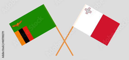 Crossed flags of the Republic of Zambia and Malta. Official colors. Correct proportion