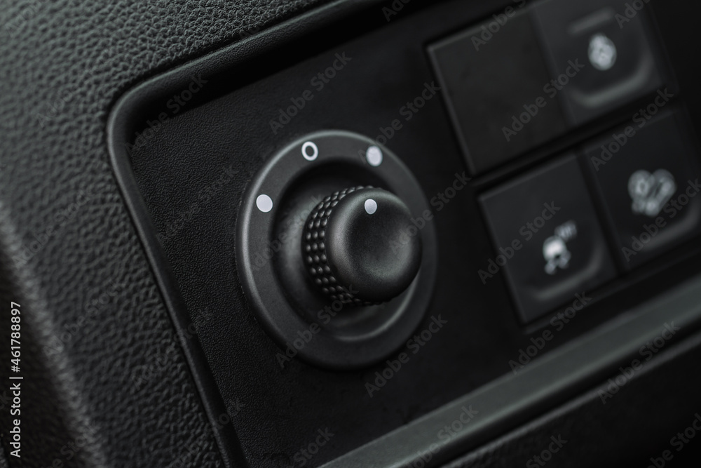 Side mirrors control panel on side door. Car driver adjust side mirror controller. Side mirror control button for adjusting the side mirrors. Side mirrors control panel on side door. Car driver adjust side mirror controller. Side mirror control button for adjusting the side mirrors.