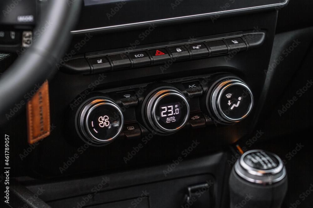 Color car air conditioning buttons close up view inside a car. Car temperature conditioner dashboard panel.