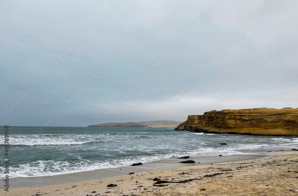 The pacific ocean crashing with Paracas desert The pacific ocean crashing with Paracas desert