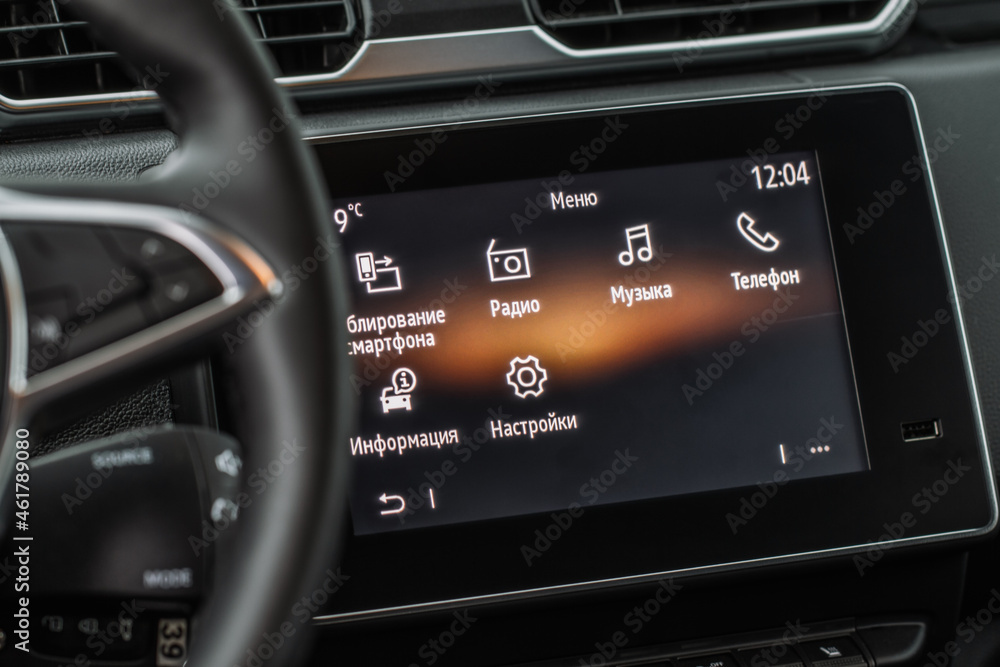 Modern car dashboard with navigation system and usb port. Car interior USB slot.