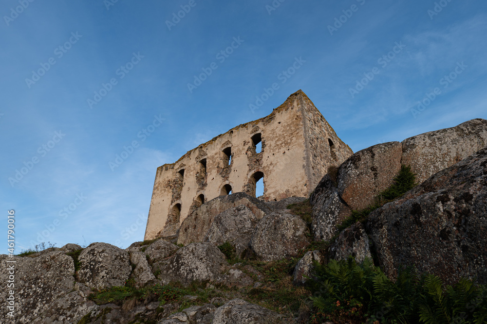 Ruins of an ancient castle on top of a cliff in Sweden.