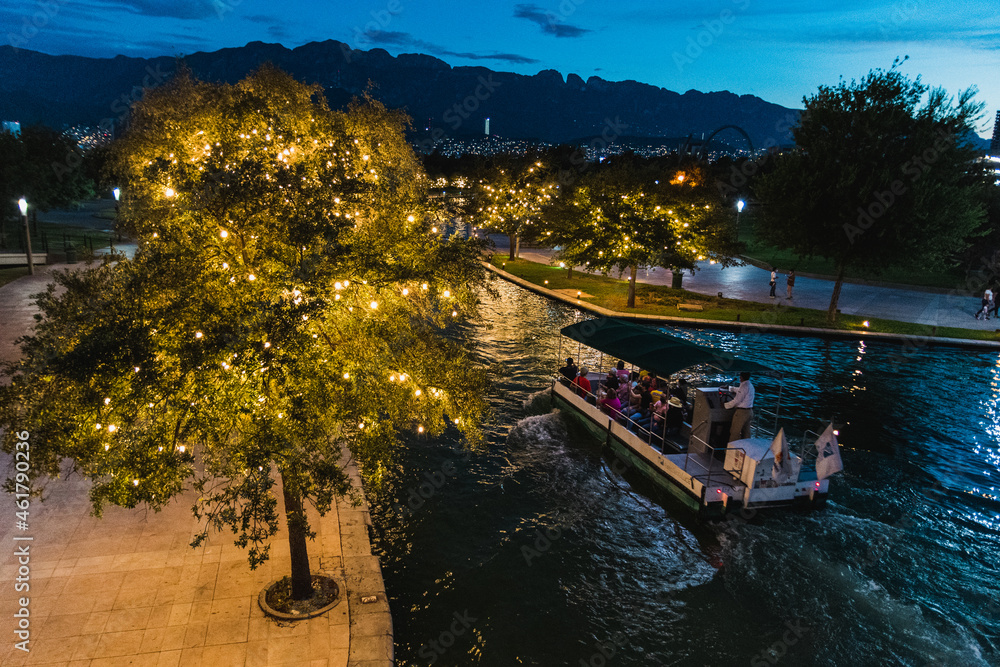 Fototapeta premium Santa Lucia river in Fundidora Park at night