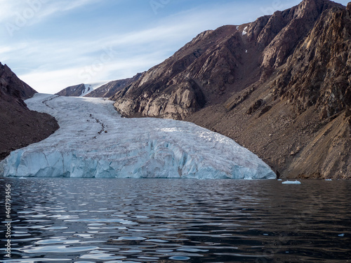 photo of mountain, glacier, sea ice, ocean and icebergs in the canadian arctic