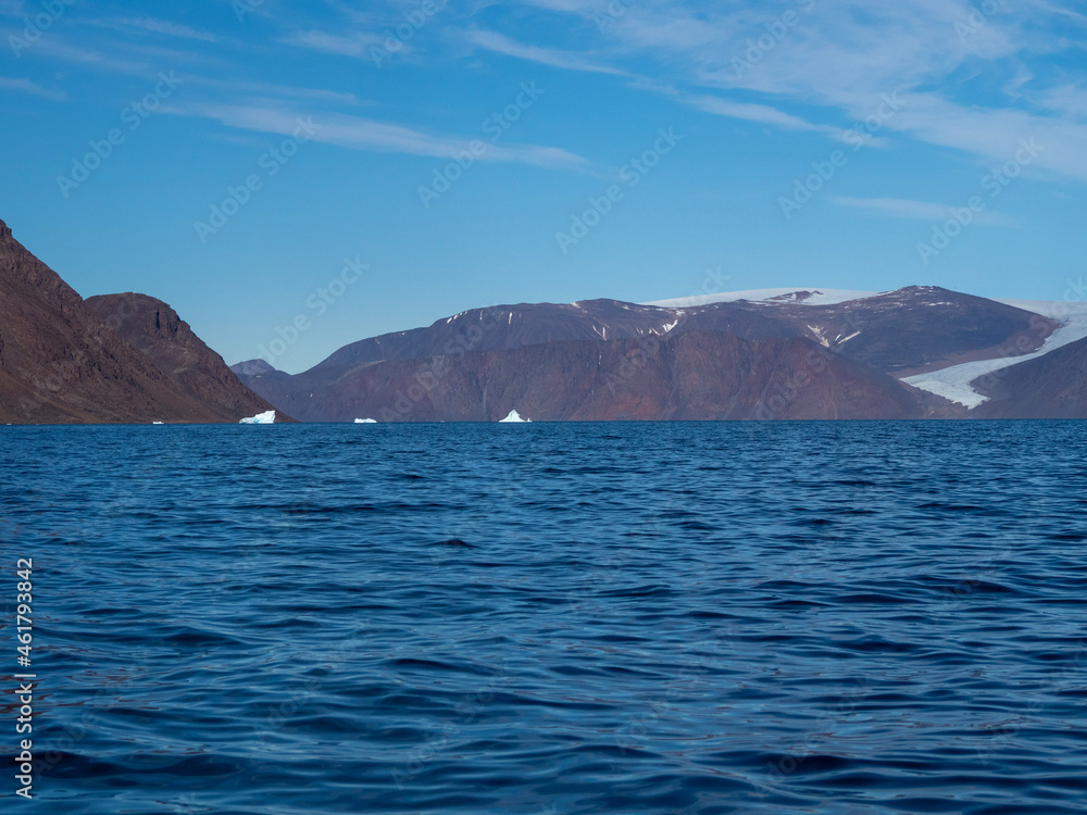 photo of mountain, glacier, sea ice, ocean and icebergs in the canadian arctic