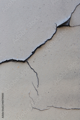 Old wall with cracked plaster. Weathered rough surface. Vintage texture is perfect for background and design.