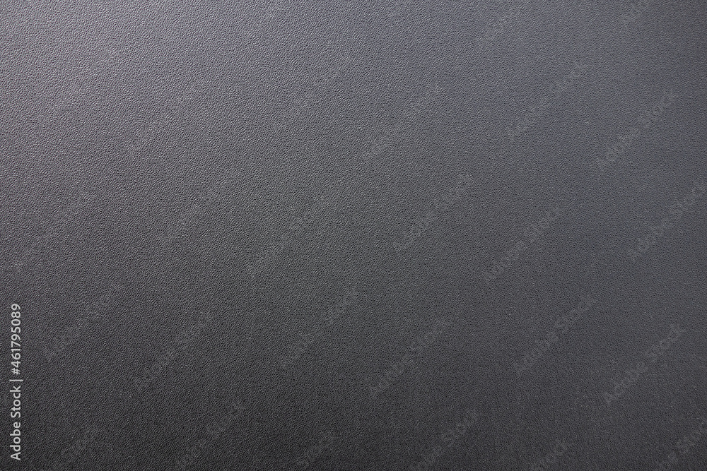 Texture of black matte plastic.Black background for the text. Dark plastic.