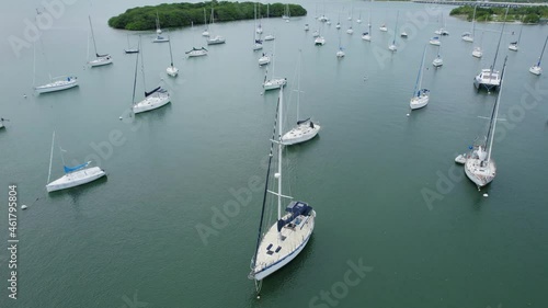 Descending over boats docked outside Crandon Marina Key Biscayne 4k revealing Miami Skyline photo