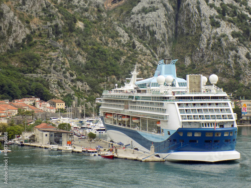  A Cruise Ship in Montenegro at Dock with the Mountain Towering Behind