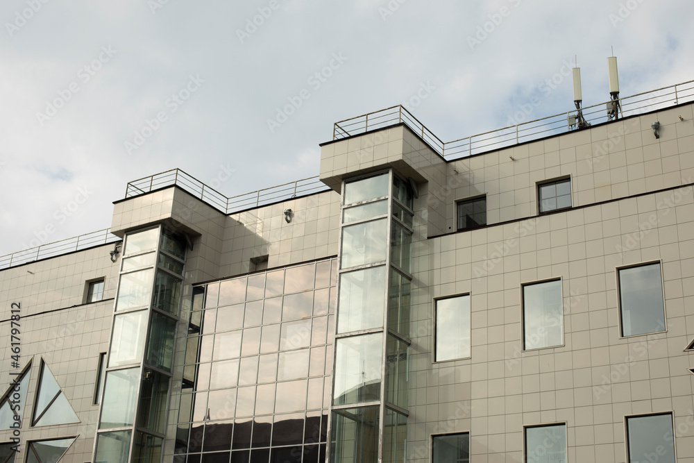 Windows in the office building. Facing panel in modern architecture.