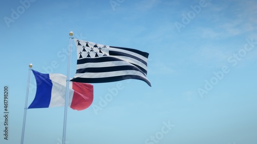 Waving flags of France and the French region of Brittany against blue sky backdrop. 3d rendering