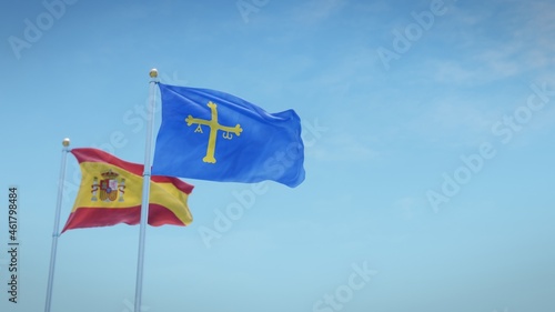 Waving flags of Spain and the autonomous community of Asturias against blue sky backdrop. 3d rendering