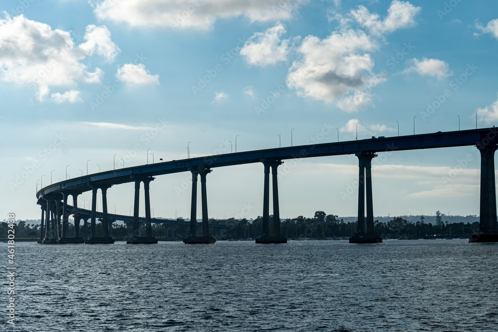 Coronado Bridge - Connecting San Diego and Coronado. The bridge goes over the San Diego Bay that feeds into the Pacific Ocean Coronado Bridge - Connecting San Diego and Coronado. The bridge goes over the San Diego Bay that feeds into the Pacific Ocean