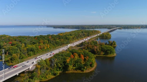 4K camera aerial drone view of Transcanada highway and fall season foliage colors in the outskirts of Montreal. photo