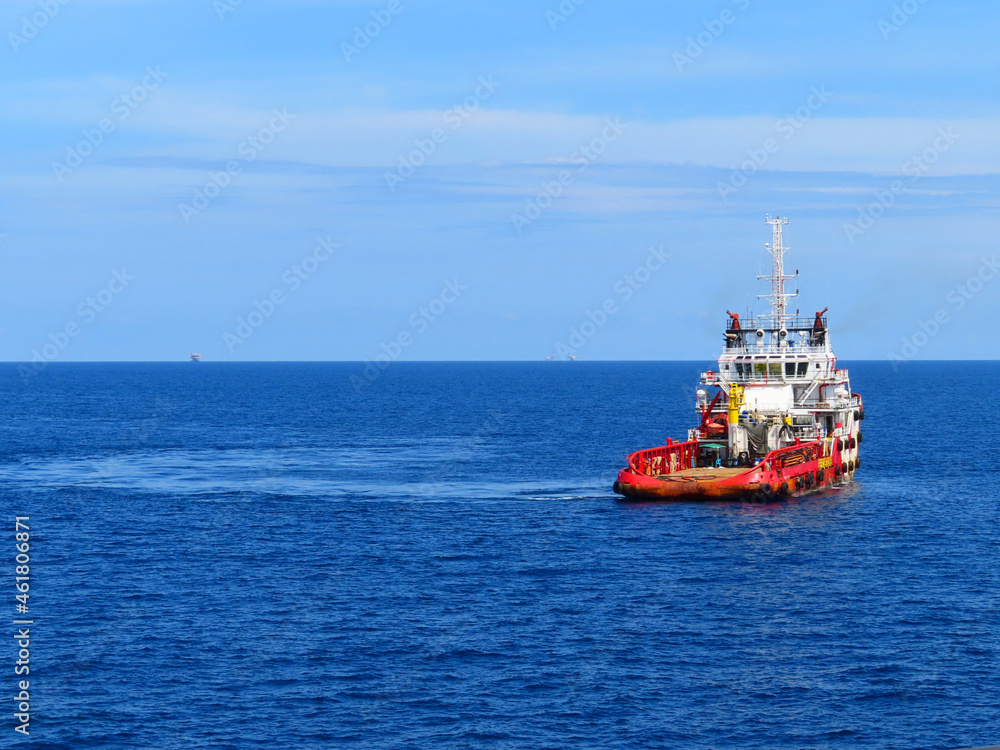 Supply boat transfer the cargo for supporting oil and gas industry and moving cargo from the boat to the platform. Boat is waiting transfer cargo and crews to platform.	