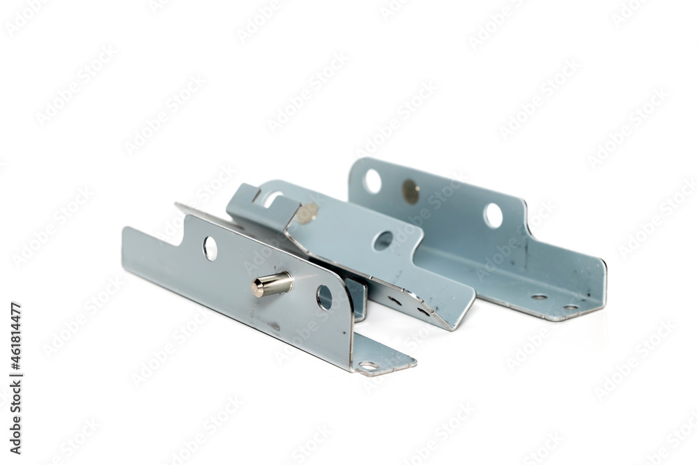 Three metal brackets with shiny metal pin on white background Three metal brackets with shiny metal pin on white background