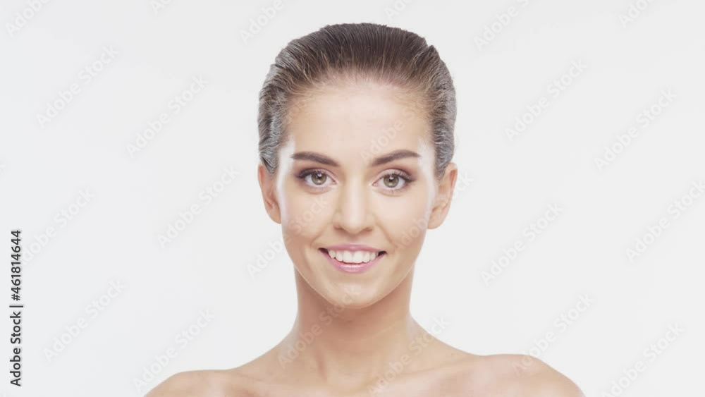 Beauty portrait of young, attractive and healthy woman. Brunette girl over white background. Natural female face. Beauty portrait of young, attractive and healthy woman. Brunette girl over white background. Natural female face.