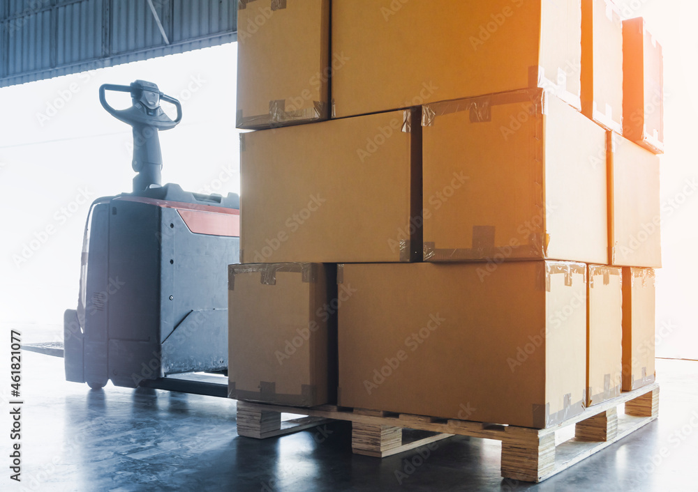 Packaging Boxes on Pallet with Electric Forklift Pallet Jack. Cargo ...