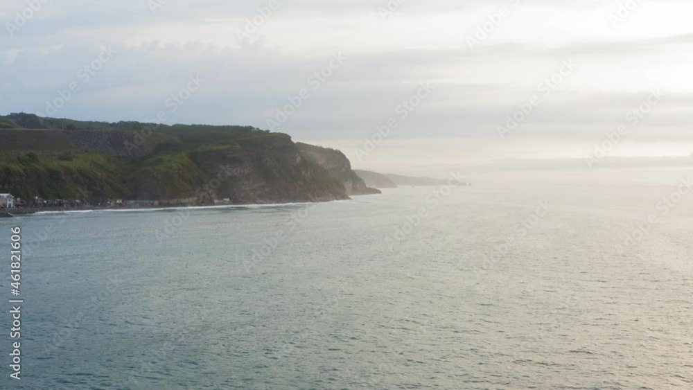 Aerial view of the picturesque high coastline, sharp cliffs and raging sea Aerial view of the picturesque high coastline, sharp cliffs and raging sea