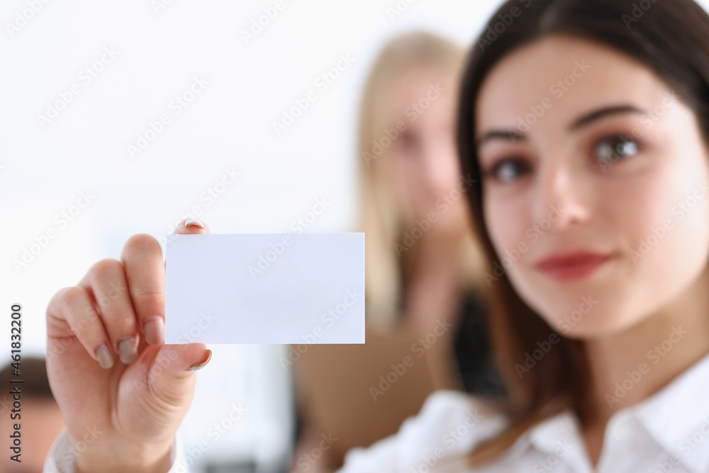 Smiling Businesswoman in suit hold in hand business card Smiling Businesswoman in suit hold in hand business card